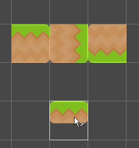 Unity displays a preview of the picked tile at the cursor in the Scene view.